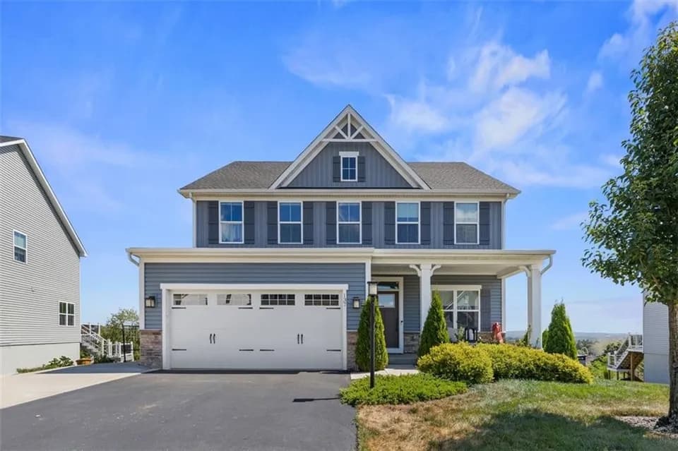 A staged colonial style home exterior from a recent listing